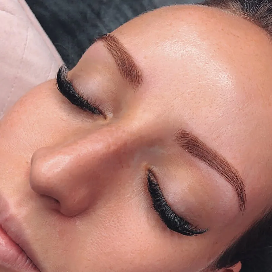 Side profile showing lash lift and tint result — natural curl and definition