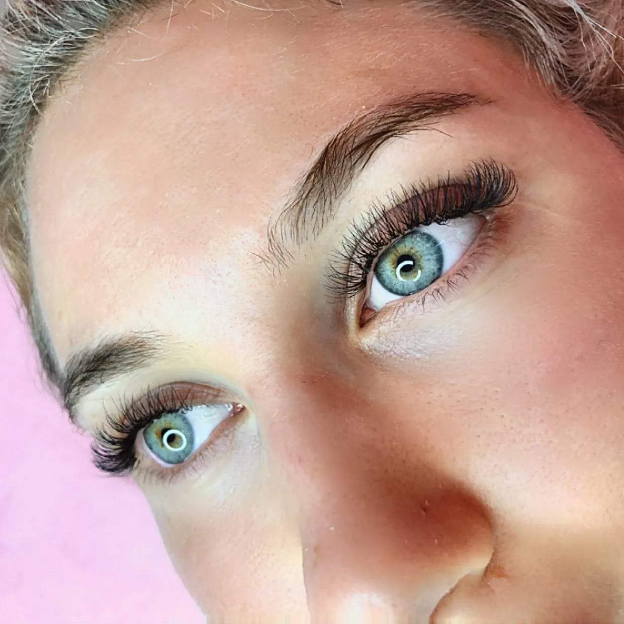 Wispy volume lash extensions on blue eyes