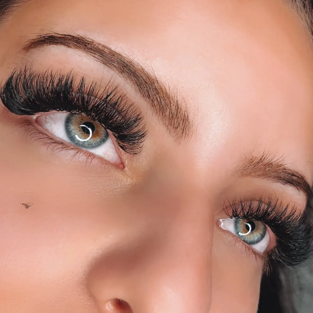 Bold dramatic volume set on blue-green eyes